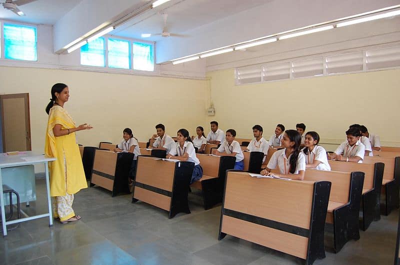 students and teacher in a classroom